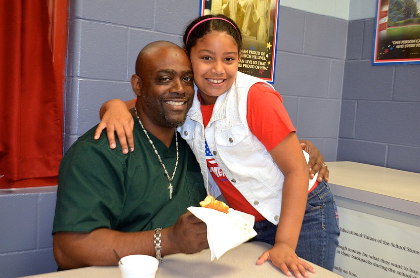 Tabah Baker and his daughter, Allyson, enjoy a morning together before school starts.
