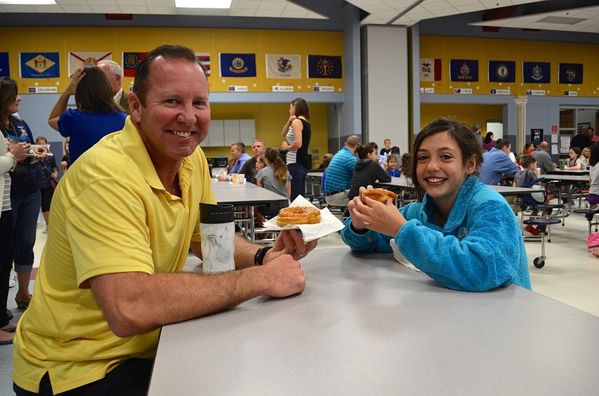 Russell and Riley Holton enjoy a sweet start to the day.