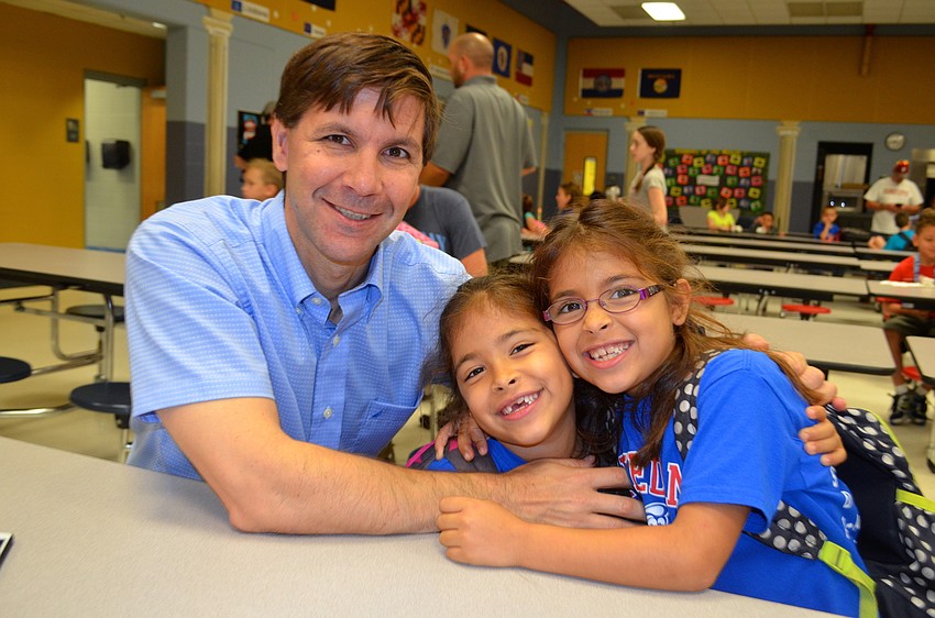 Chris, Daniela and Alexandra Landy share laughs before school.