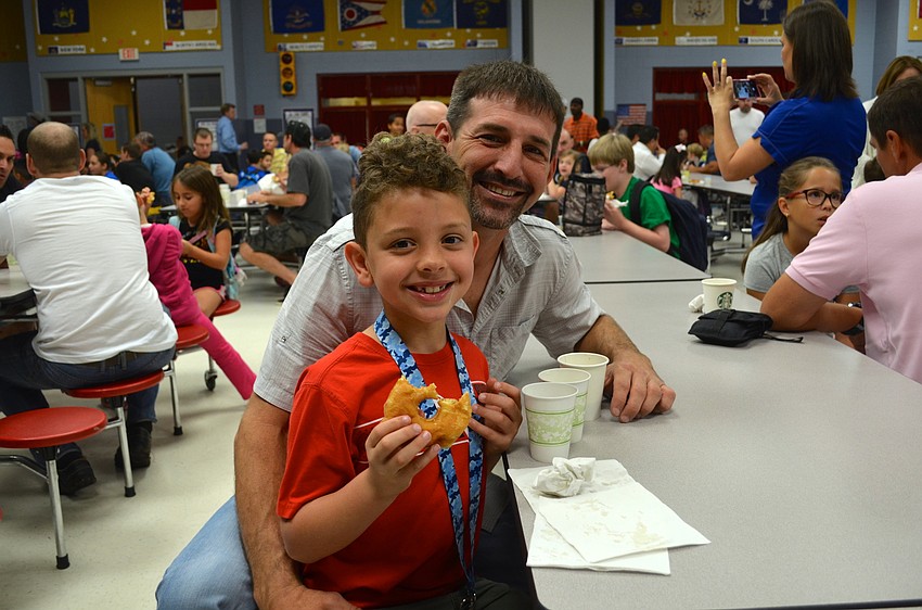 Camden Marley and Tony Helmer show off their breakfast.