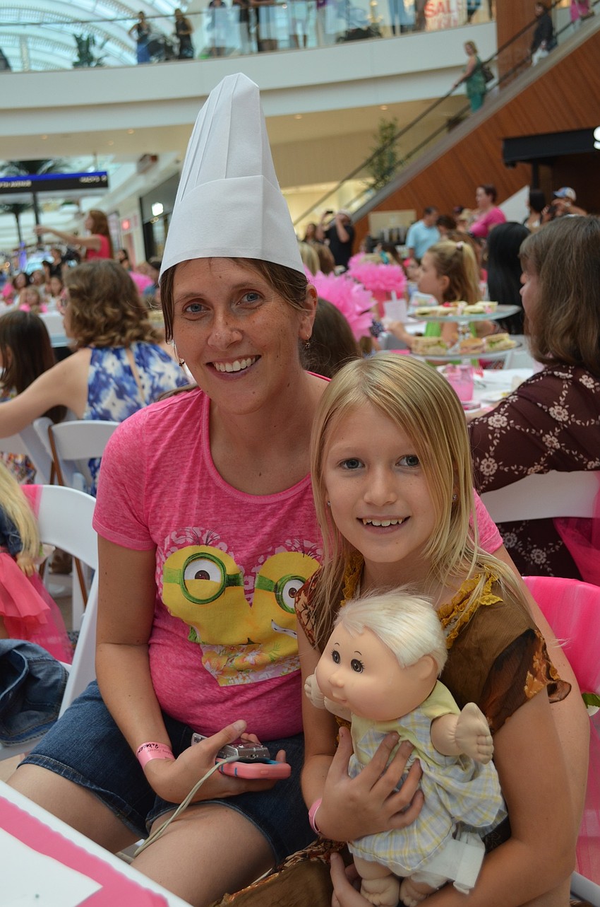 Angela and Savannah Loukota enjoy a cooking demonstration and fashion show.