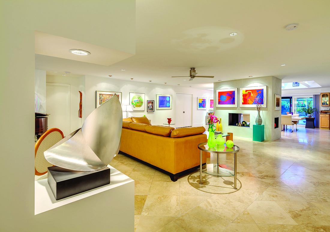 The homeâ€™s large living area provides plenty of space to display the ownerâ€™s collection of paintings and sculptures.