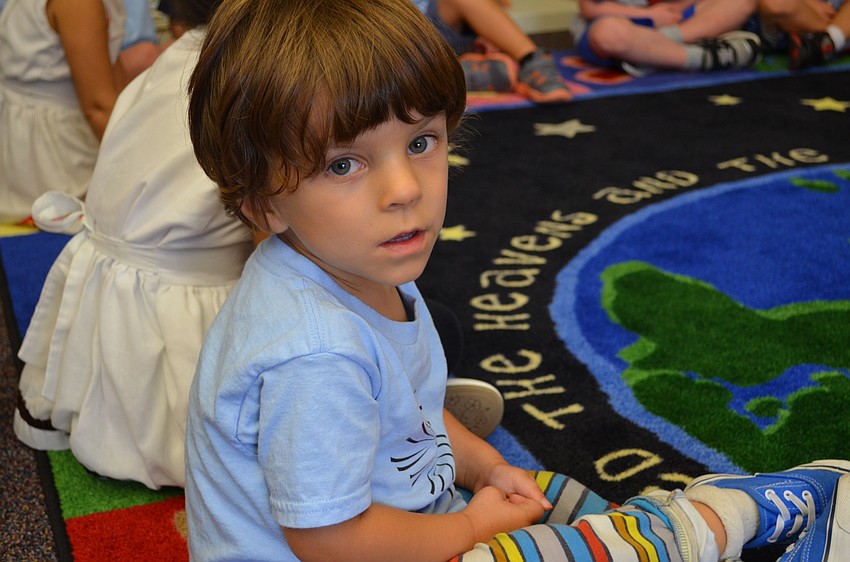 Daniel Fine sits during story time.