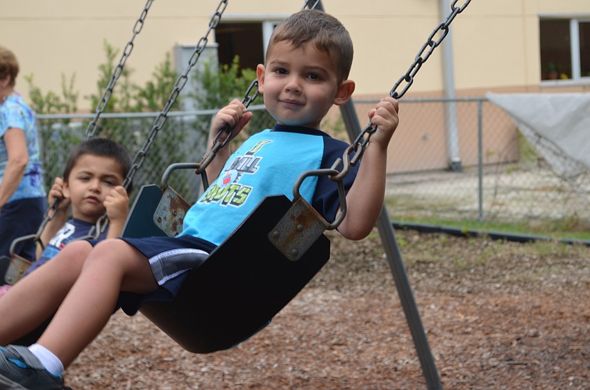 Ezra Wheeler soars on the swings.