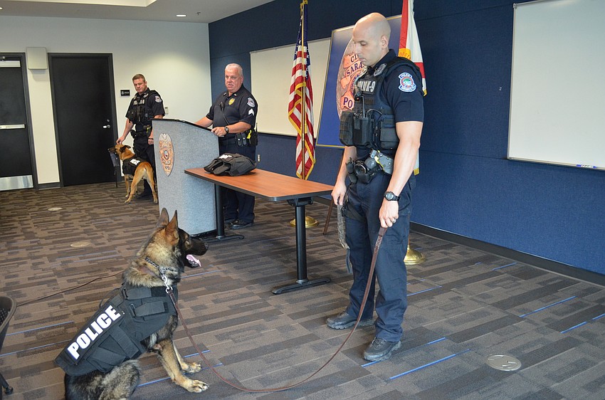 K-9 Officer Bronson and Officer Jake Nelson during the ceremony Tuesday Morning.