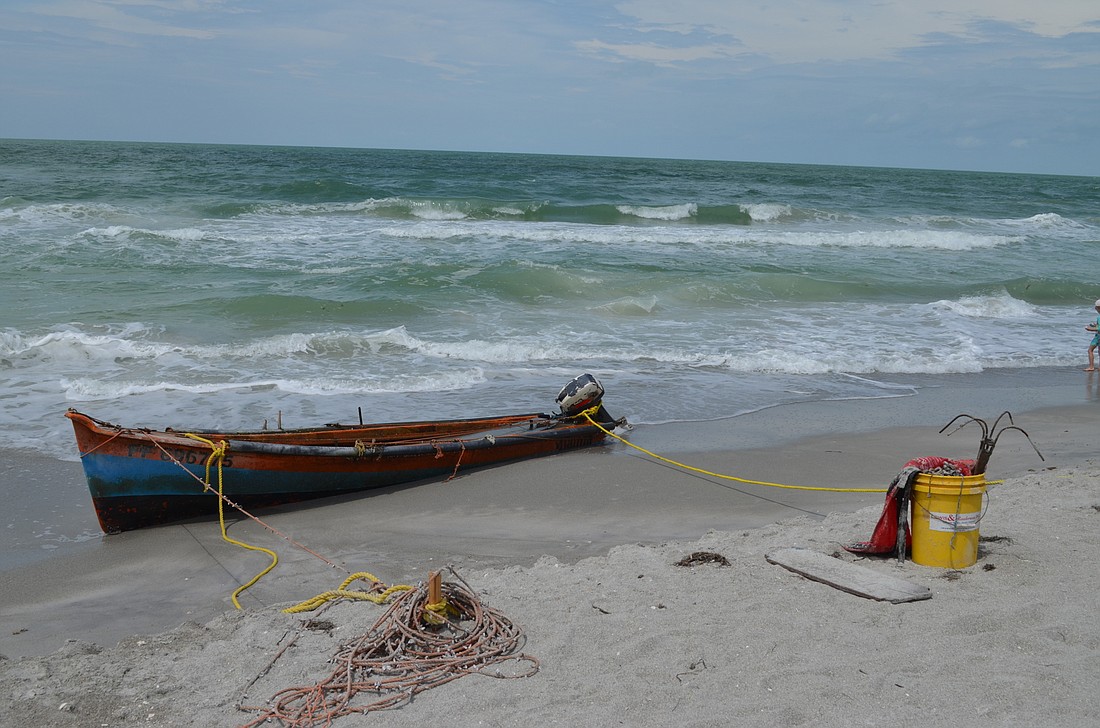 Longboat Key Marine Patrol is working to call a service department to have the boat removed from the beach Wednesday.