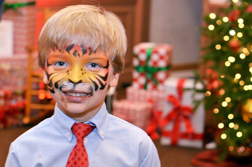 Jack Bogan wears face paint at Christmas in Candyland.