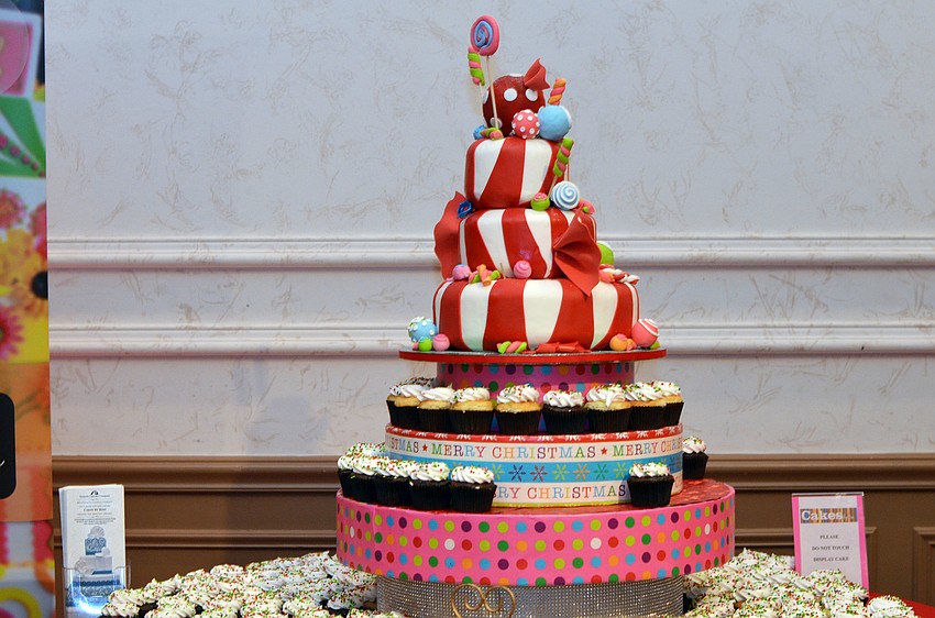 Guests enjoyed cupcakes offered on a rotating candy cake at Christmas in Candyland.