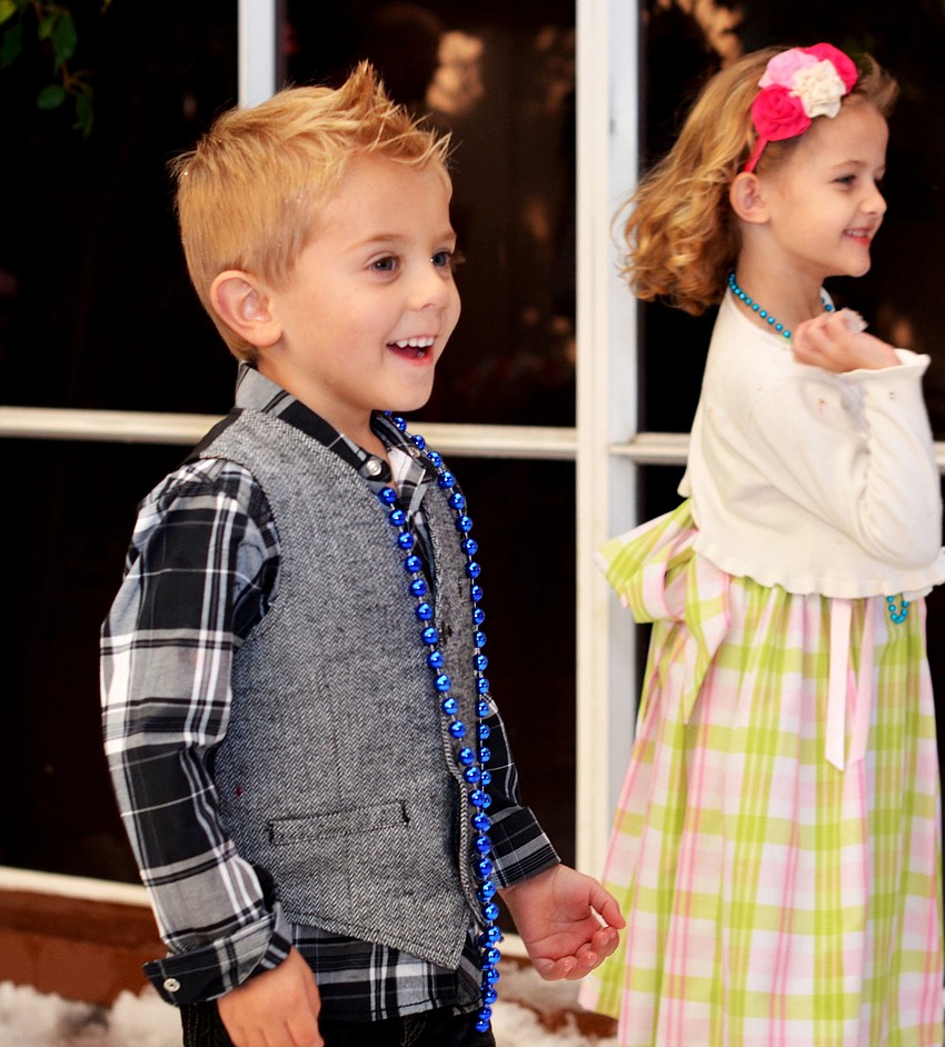 Children play in the snow at Christmas in Candyland.
