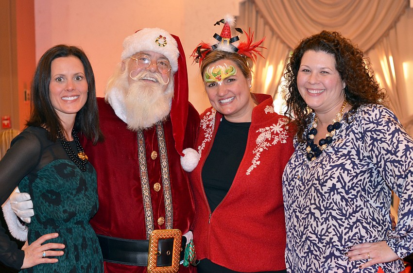 Co-Chair Shana Zamikoff, Santa Claus, Rebecca Blitz and Co-Chair Bianca Lawrence