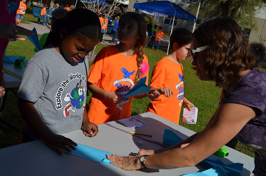 Jamiyah Johnson learns how to fold her plan from Darbi Bossman.