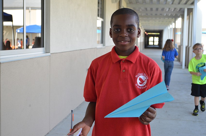 JoshuaHenderson-Joshua Henderson shows off his paper plane.