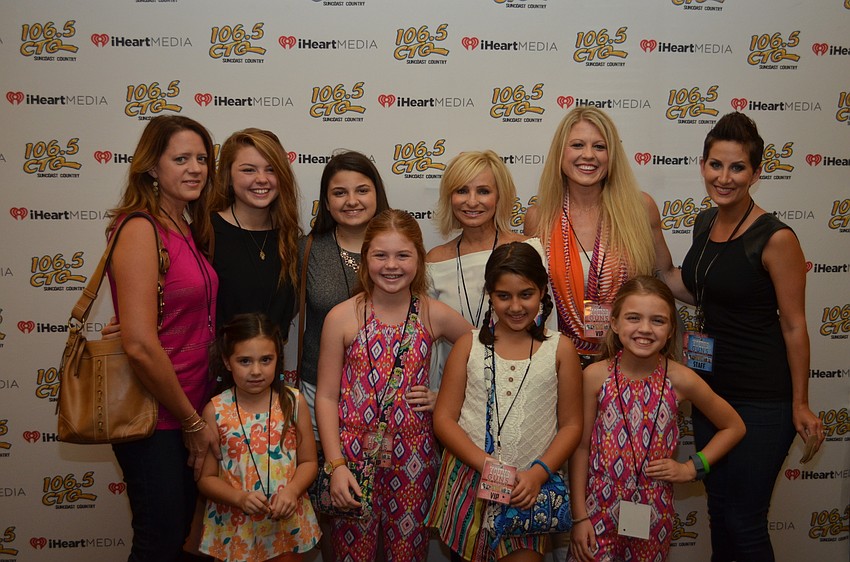 A group of female country fans with country music radio host Lulu from 106.5 CTQ, Sarasota's country radio station.