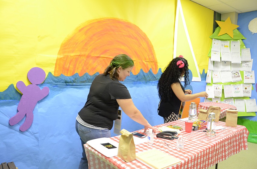 Lynne Uribe and Isabel Macgloan prepare campfire treats.