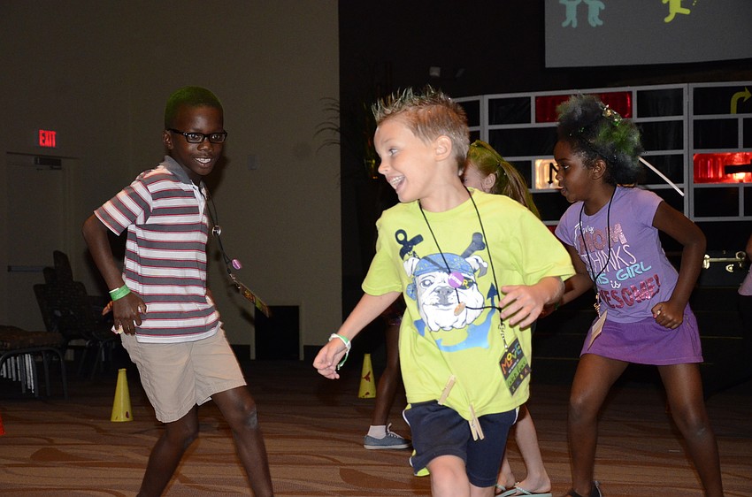 Caleb Parks, left, keeps his clothespins safe from Herbert Amoah, right, during a game of indoor tag.