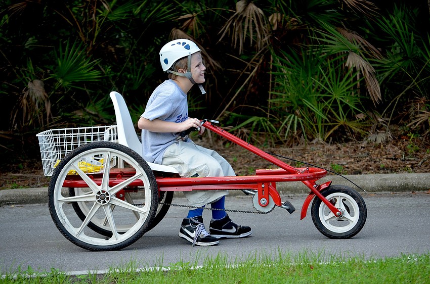 Ethan Hills takes a break from bike riding.