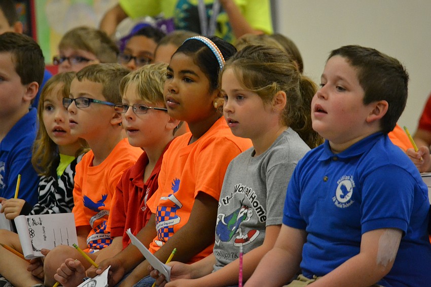 Students listen to instructions before the start of the Measurement Olympics.
