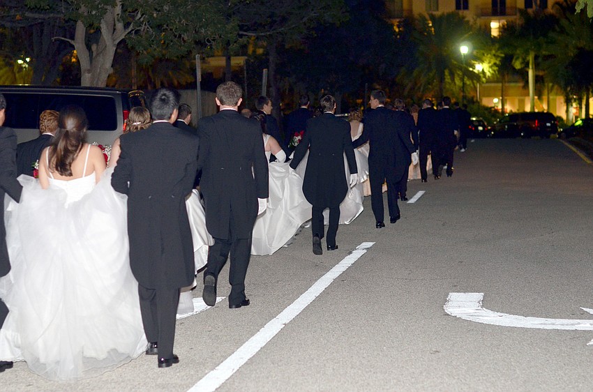 The 2014 debutantes make their way to the ballroom at The Debutante Ball.