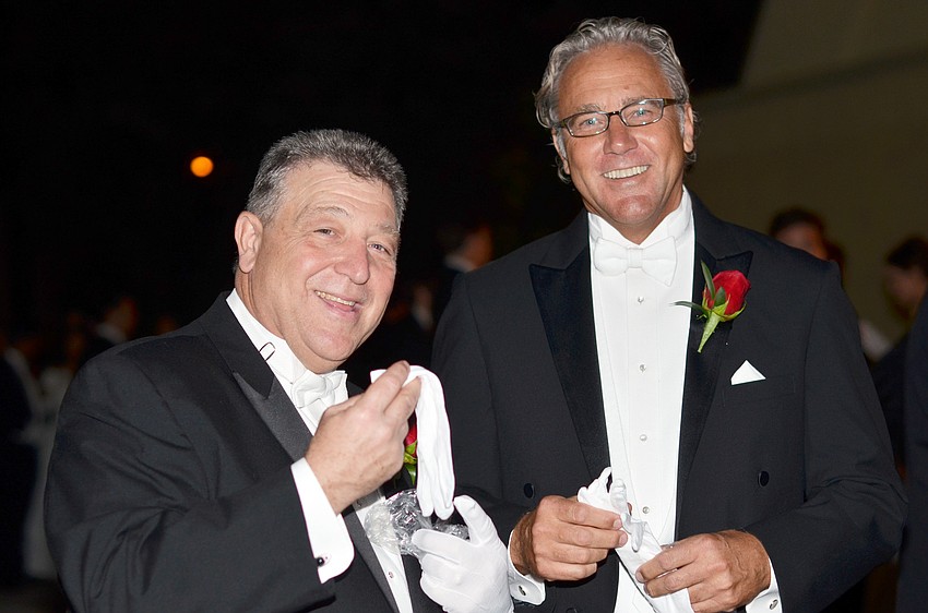 Tony Incardona and Douglas Baker put on their gloves before The Debutante Ball.