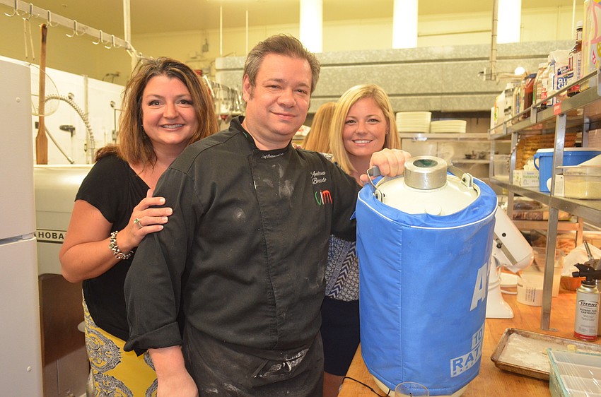 Spice & Tea Exchange owner Paulette Callender, Amore chef Andrea Bozzolo and Sarah Zabel with a liquid nitrogen container used to make ice cream.