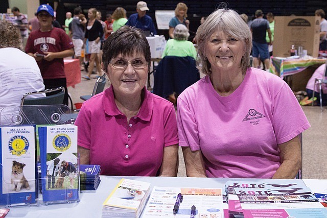 Joni Trickett and Trouchen Oran, of the Sarasota Obedience Training Club, pass out information about their organization. Photo courtesy of Mindy Towns.