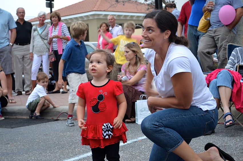 Nova Ayling and her mother, Michelle, are intrigued by the band.