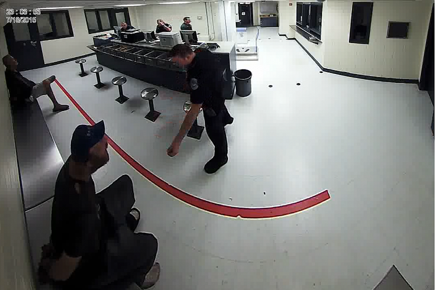 Video footage from the Sarasota County jail showed the officer repeatedly throwing food at a handcuffed individual.
