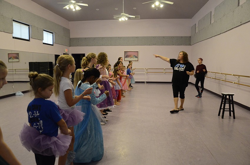 Kristina Babcock teaches the 24 girls the next part of their Disney Diva routine.