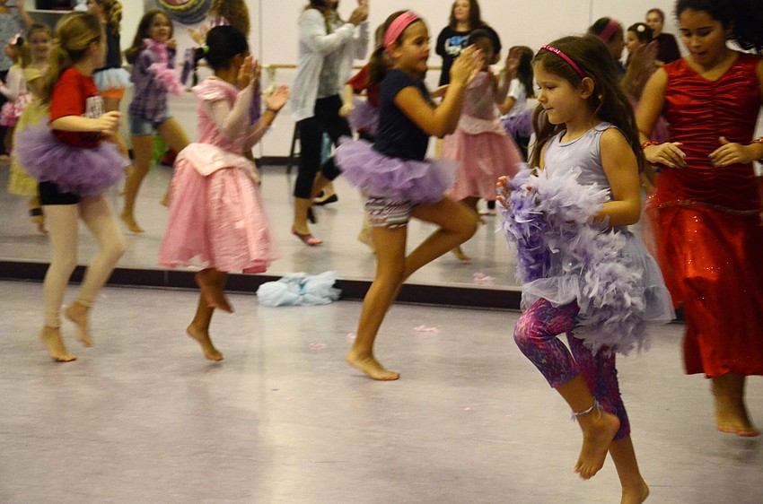 Emma Rodman, 7, leads a skipping circle.