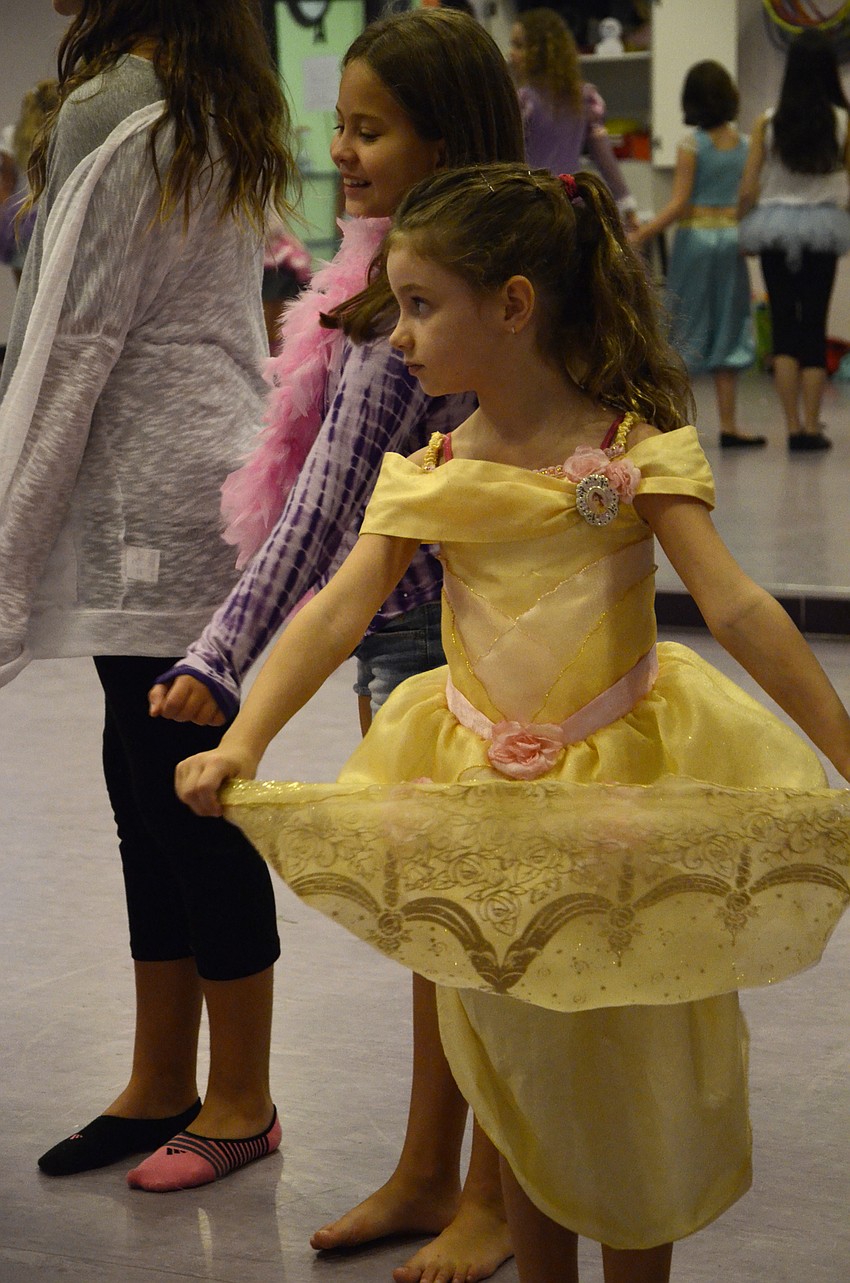 Elizabeth Cranston, 6, twirls her skirt.