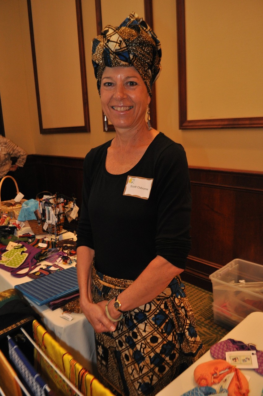 Scott Osborne wears West African garb as she attends the U.N. Women’s table, which displays garments, jewelry and other items from around the world.