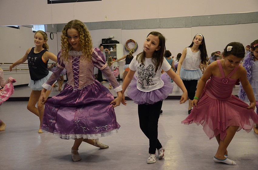 Belle Babcock,12, Emily Davis, 7, and Madison Hayes, 9, courtesy at the end of the routine.
