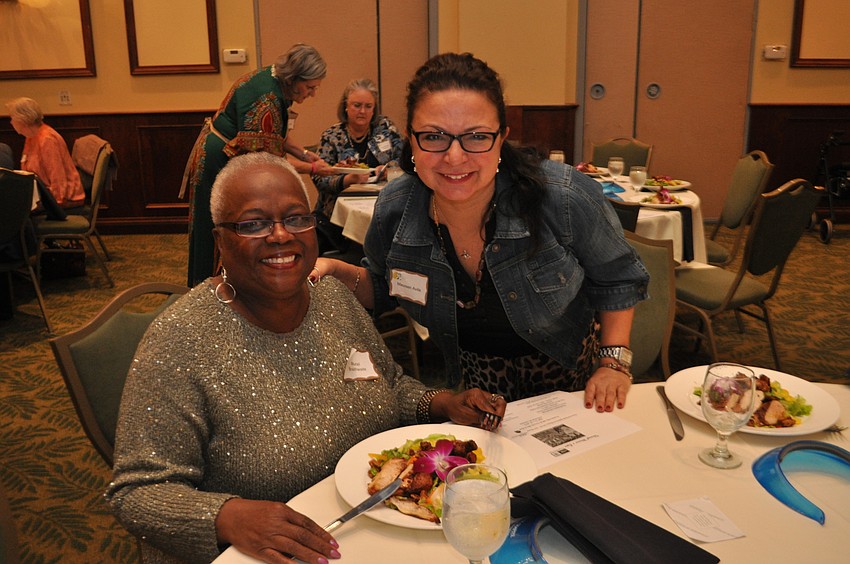 Muriel Brathwaite, founding member of U.N.Women, eats lunch with Maureen Avila.