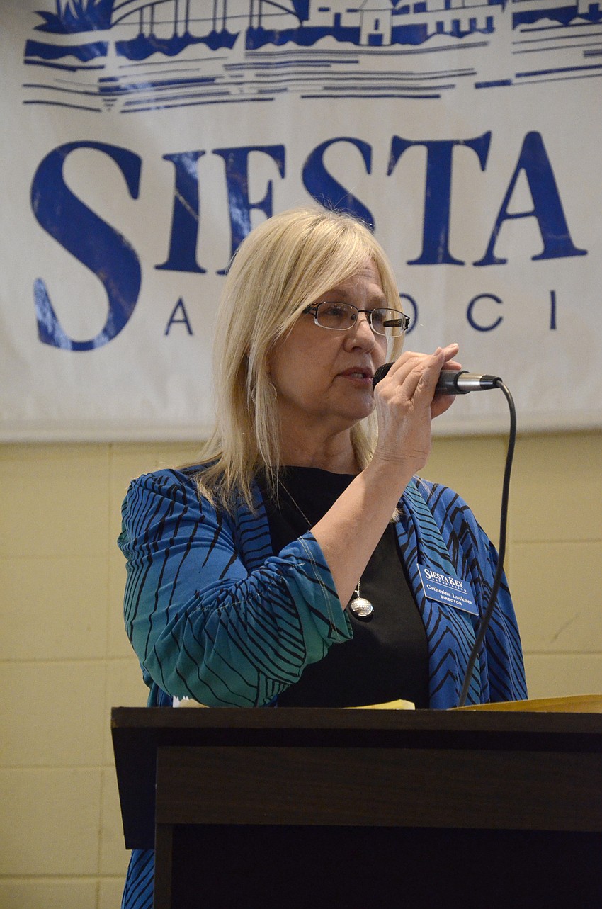 Catherine Luckner updates members about the U.S. Army Corps' Big Pass Dredge.