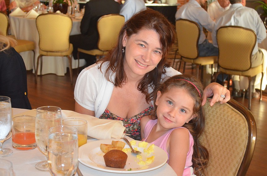 Scholarship recipient Katrina Grey with daughter, Vivian, 5