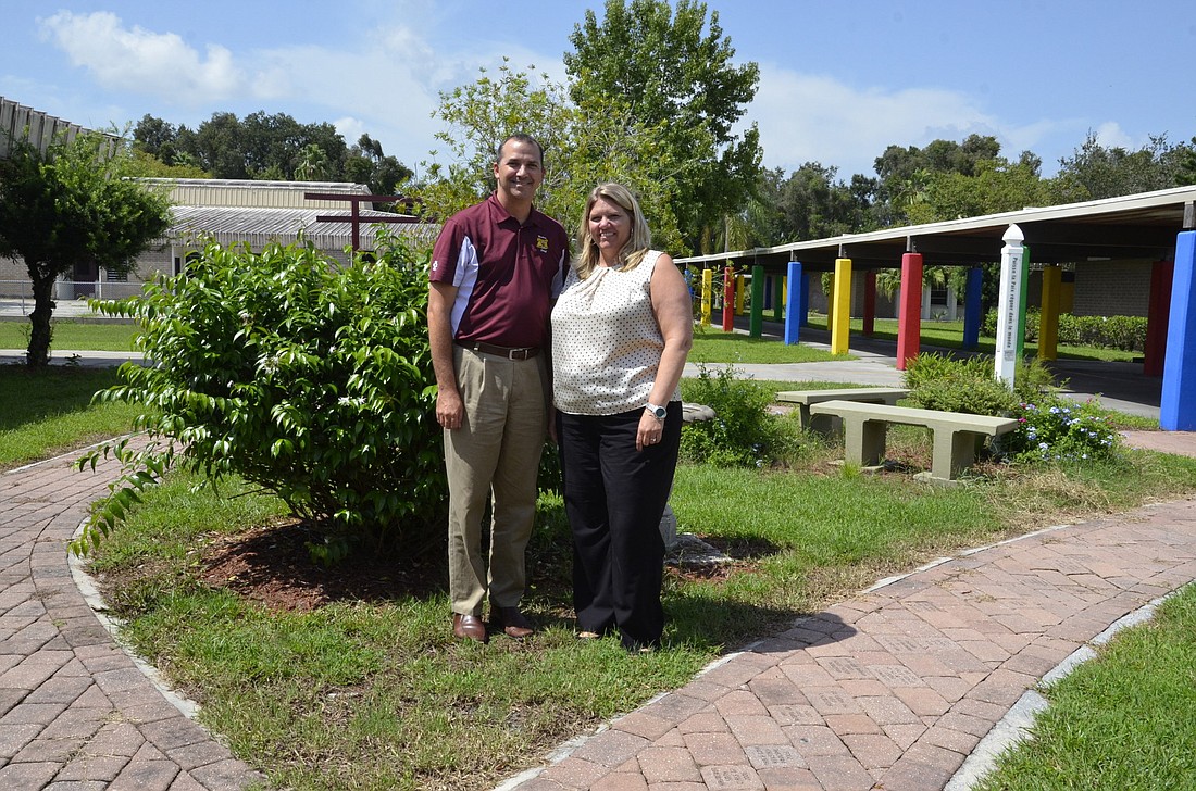 Principal Joshua Bennett and Assistant Principal Beth Marshall in the Bashaw Peace Garden