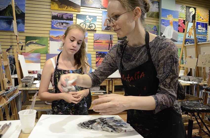 Marie-Pierre Hamel gets help from instructor Natalia Akhmetova.