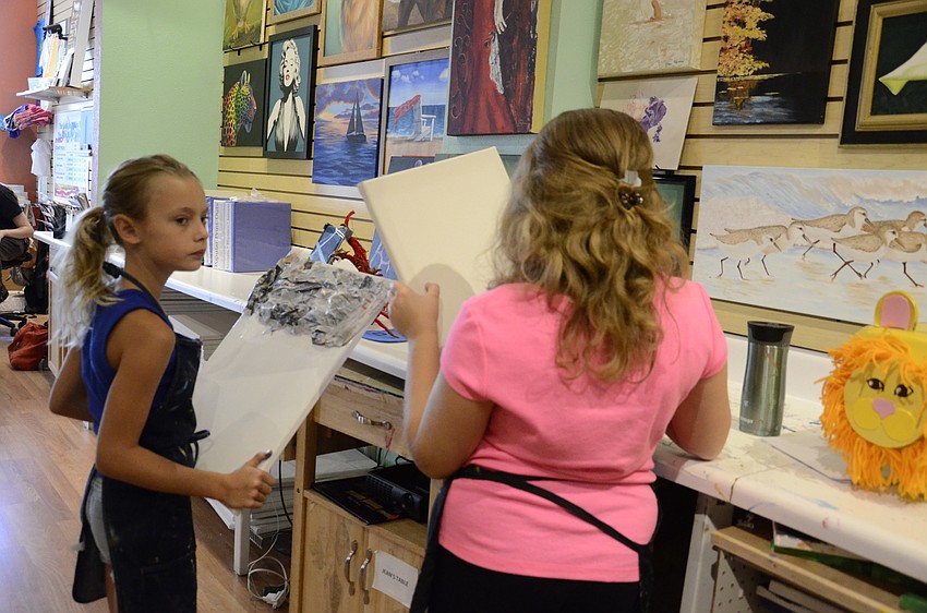 Kelsey Testore and Alexis Intelisano dry off their projects.