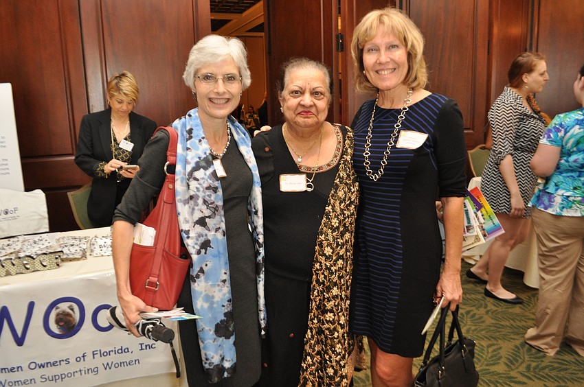 University of South Florida Sarasota-Manatee Chancellor Sandra Stone poses with Dr. Mona Jain and State College of Florida professor Darlene Wedler-Johnson.