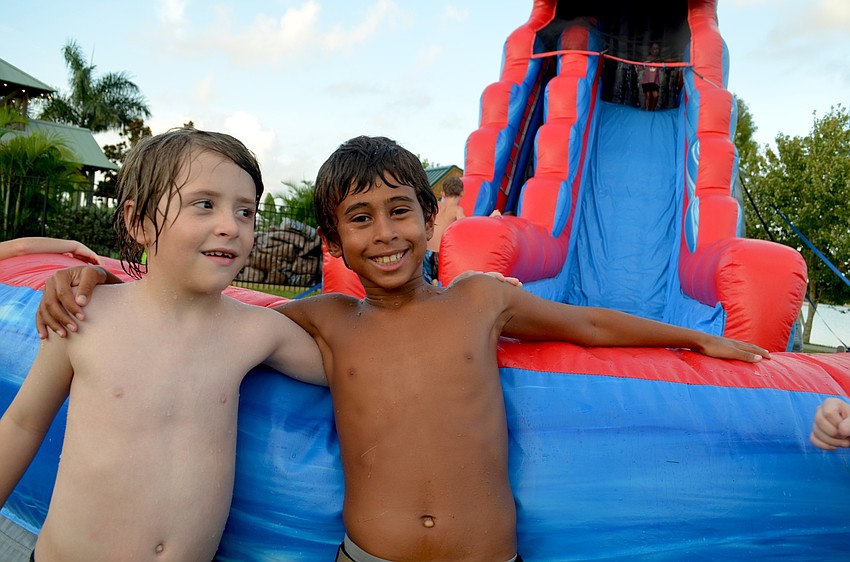 Miles Cane and Teddy Jordan wait for their turn to whip down a water slide.