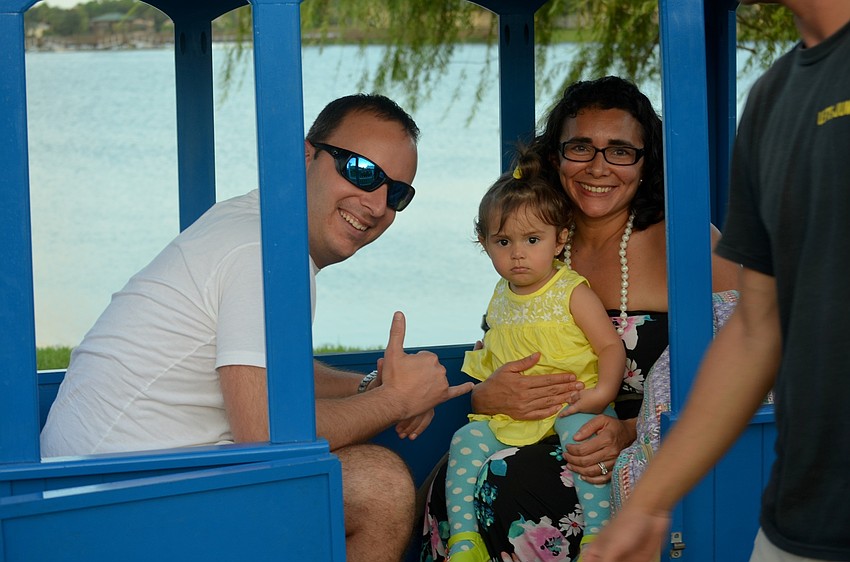 Steve, Summer and Andrea Tucci embark on a train ride around Main Street.