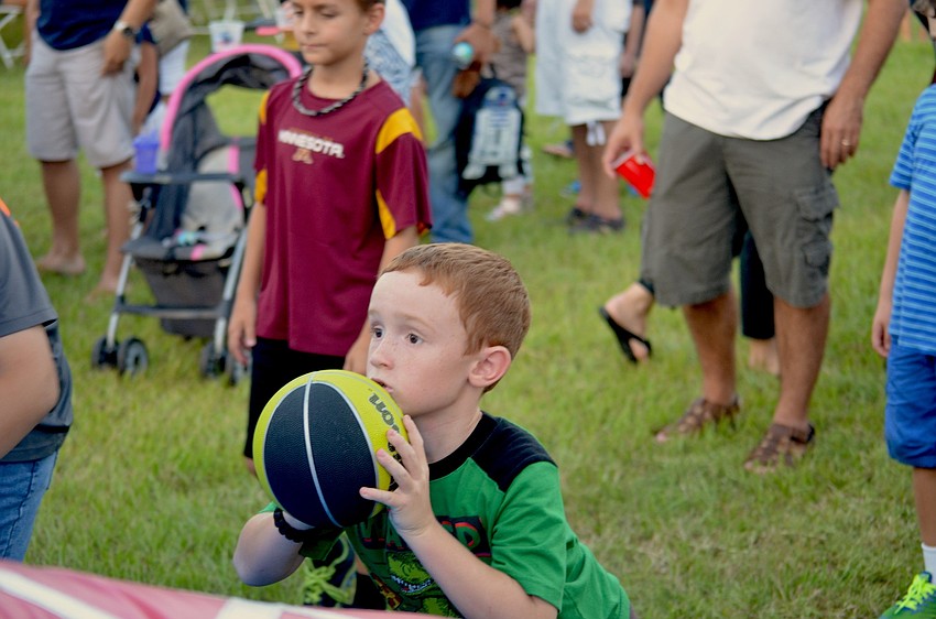 Cade Perrine focuses on the basketball hoop.