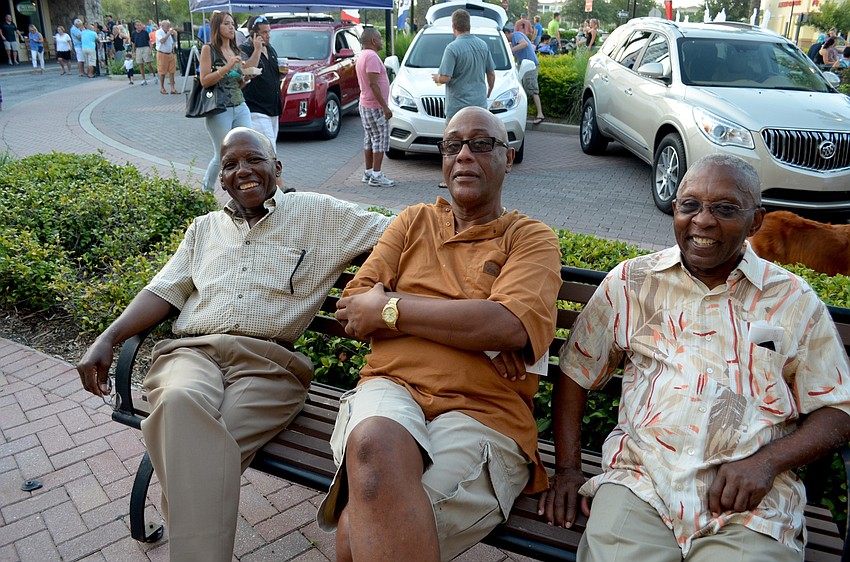 Norman Campbell, Colin McKenzie and Neville Darby people watch while listening to a range of music.