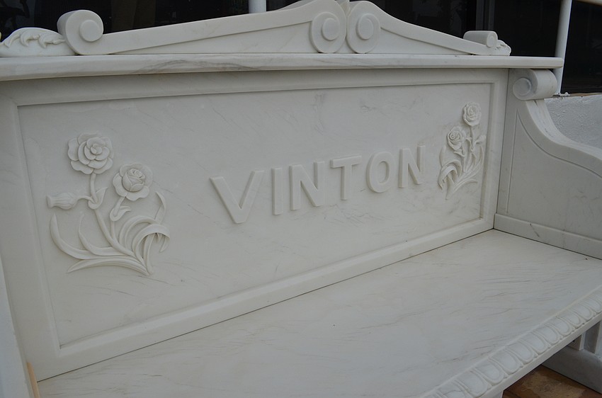 A bench overlooking the bay with the Vinton name.