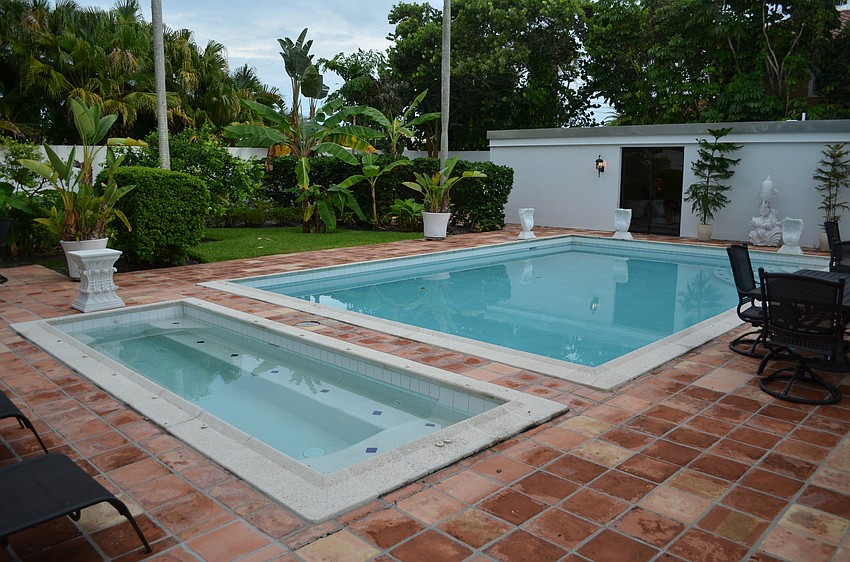 The swimming pool area and guest house.