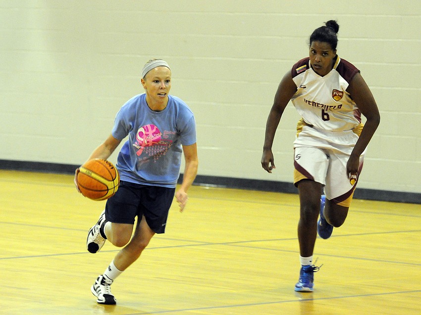 Sarasota Rec League’s Jen Thoennissen brings the ball up the court in the first half versus Venezuela.