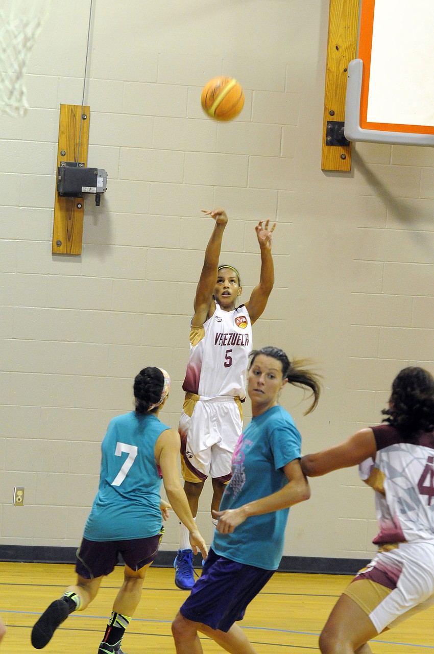 Venezuelan point guard Roselis Silva puts up a shot in the first half.