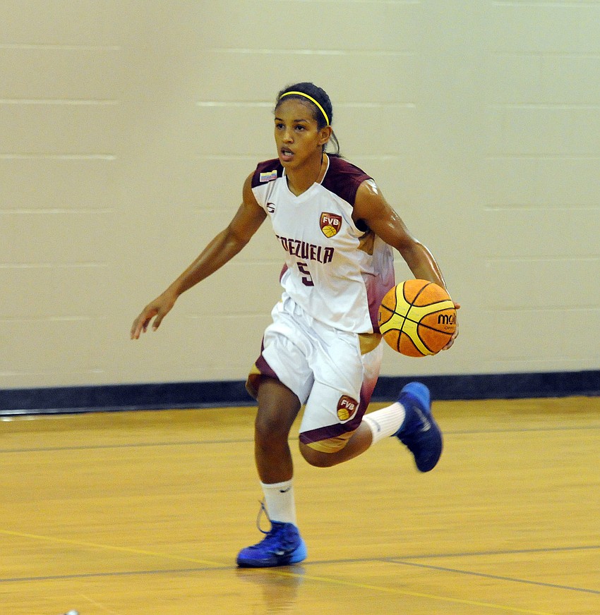 Point guard Roselis Silva brings the ball up the court for Venezuela in the first half.