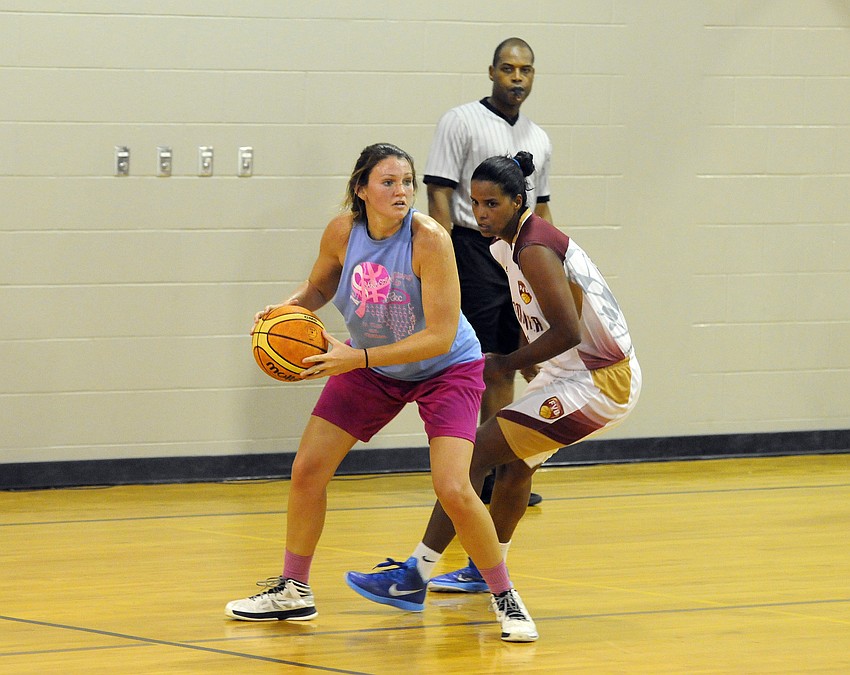 Tylar Tracy looks to pass the ball to a teammate during the Sarasota Rec League’s game versus the Venezuelan Women’s National Team.