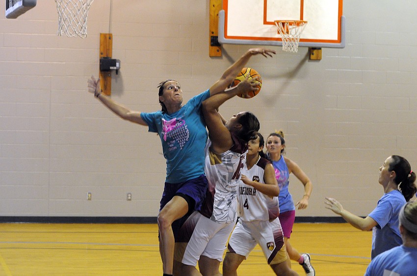 Ashley Gabbert blocks Venezuela’s Cynthia Polanco’s shot in the first half.